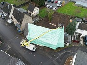 Scheuerfeld House, protection foil mounting: work on the northern roof ridge