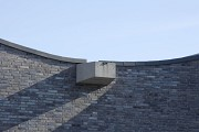 Church by the Sea: the water spout is placed at the lowest roof-point