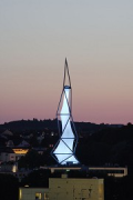 Phänomenta: illuminated tower at dusk seen from Anna-hill